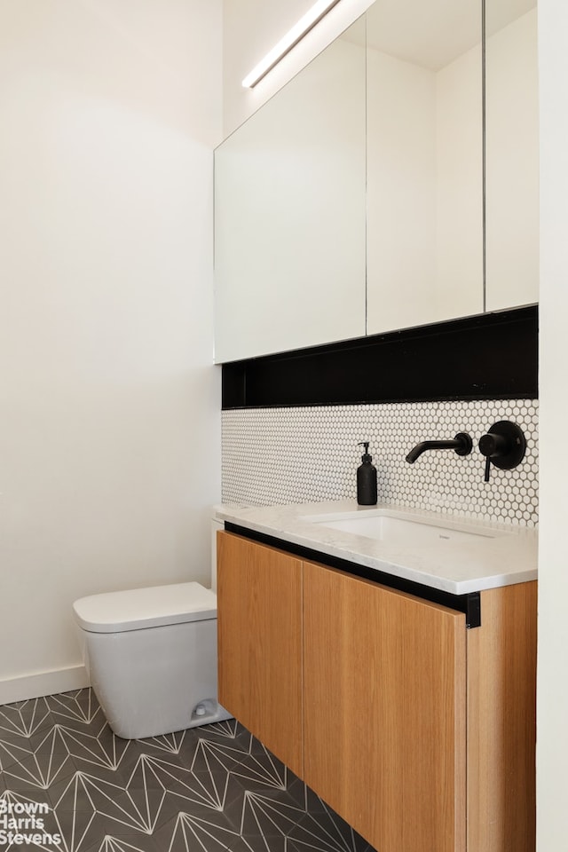 207 N 5th St Ph, Ph, New York City, NY 11211 - bathroom with vanity, tasteful backsplash, and tile patterned floors