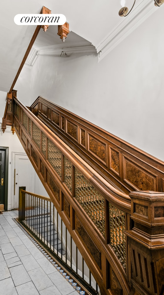 269 Clinton Ave Unit C1, New York City, NY 11205 - stairway featuring ornamental molding and tile patterned flooring