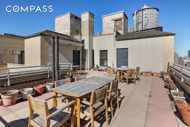 24 Monroe Pl Unit 7D, New York City, NY 11201 - view of patio featuring outdoor dining area and a city view