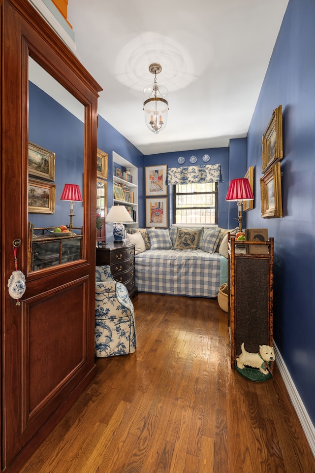 56 W 71st St Unit 1B, New York City, NY 10023 - bedroom with wood finished floors and a chandelier