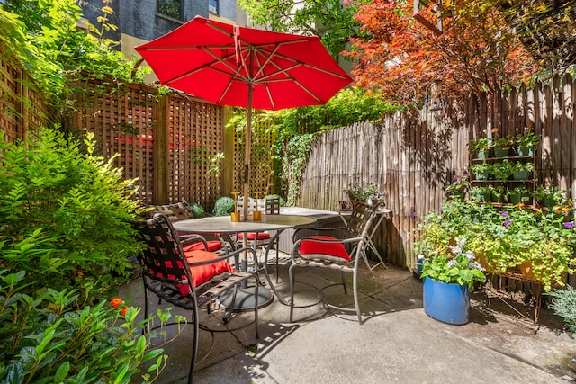 56 W 71st St Unit 1B, New York City, NY 10023 - fenced backyard featuring a patio area and outdoor dining area