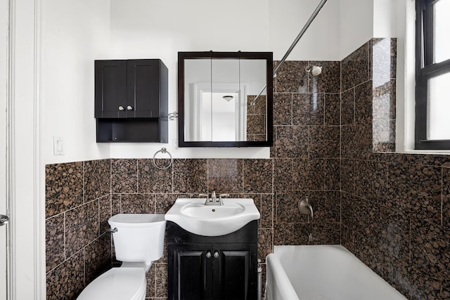 401 W End Ave Unit 6E, New York City, NY 10024 - full bathroom featuring tile walls, vanity, bathtub / shower combination, and a wainscoted wall