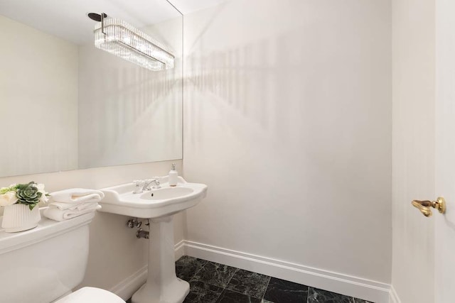 50 Riverside Dr Unit 10B, New York City, NY 10024 - half bathroom with baseboards, toilet, and marble finish floors