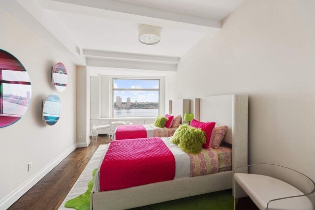 50 Riverside Dr Unit 10B, New York City, NY 10024 - bedroom with wood finished floors, baseboards, a water view, and beamed ceiling
