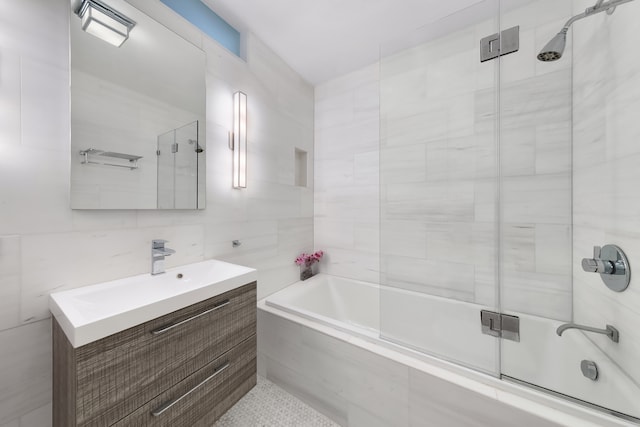 10 Bleecker St Unit 7A, New York City, NY 10012 - bathroom with tile walls, vanity, and shower / bath combination with glass door