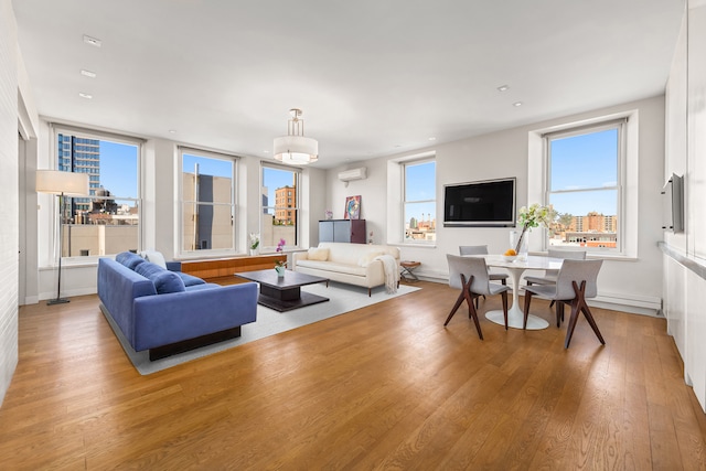 10 Bleecker St Unit 7A, New York City, NY 10012 - living room featuring wood finished floors, baseboards, and recessed lighting