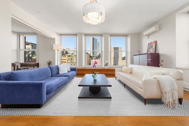 10 Bleecker St Unit 7A, New York City, NY 10012 - living room with wood finished floors and a wall unit AC