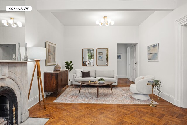 111 E 10th St Unit 20, New York City, NY 10003 - living room with a chandelier and baseboards