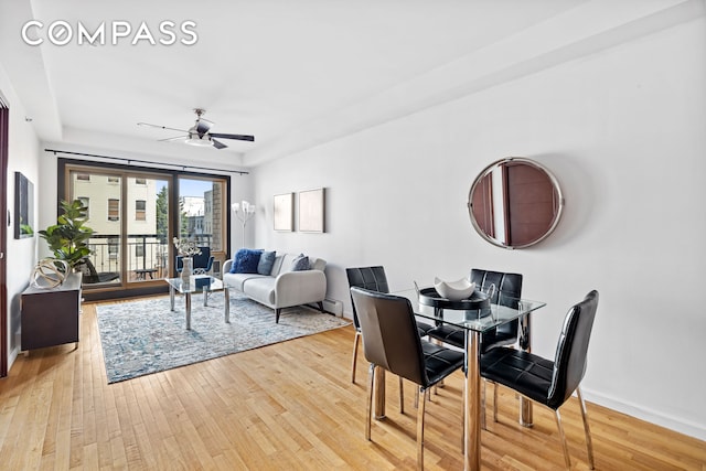 228 Bushwick Ave Unit 3B, New York City, NY 11206 - dining room with a ceiling fan, light wood finished floors, and baseboards