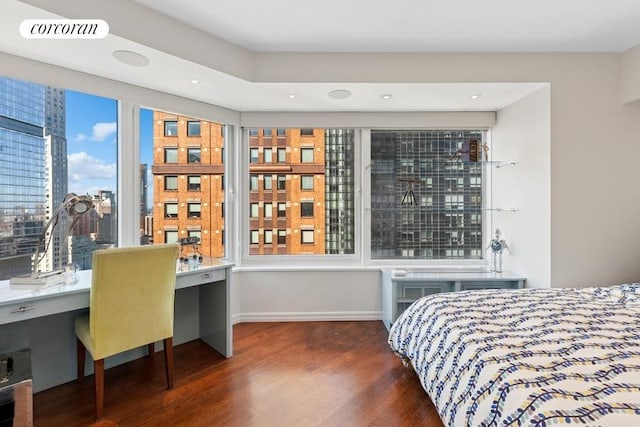 150 W 56th St Unit 3607, New York City, NY 10019 - bedroom featuring wood finished floors, multiple windows, baseboards, recessed lighting, and a city view