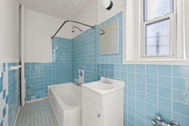 601 E 19th St Unit 3O, New York City, NY 11226 - bathroom featuring tile walls, healthy amount of natural light, vanity, and shower / tub combination