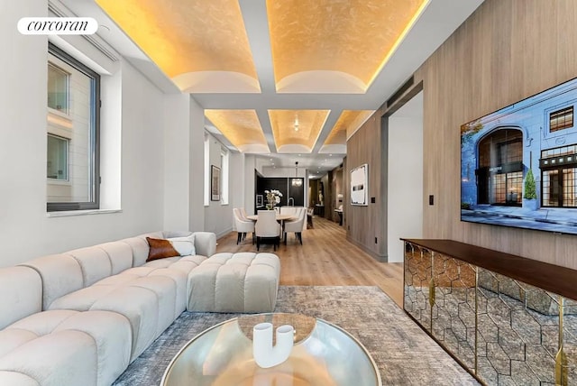 305 E 61st St Unit 402, New York City, NY 10065 - living room featuring light wood finished floors and a tray ceiling