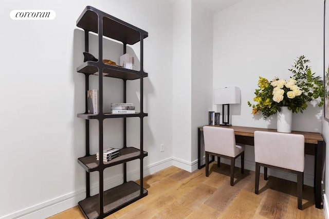 305 E 61st St Unit 402, New York City, NY 10065 - office area featuring light wood-style flooring and baseboards