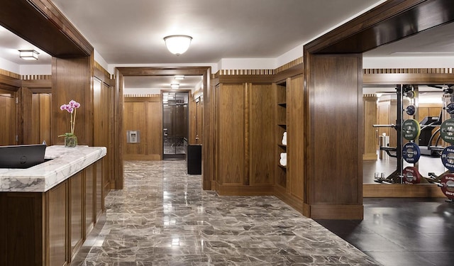 155 W 11th St Unit 14D, New York City, NY 10011 - hall featuring wooden walls and marble finish floors