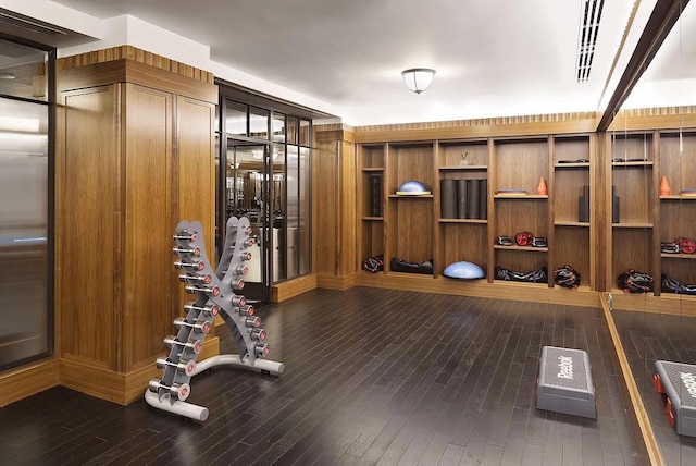 155 W 11th St Unit 14D, New York City, NY 10011 - workout area featuring dark wood-type flooring