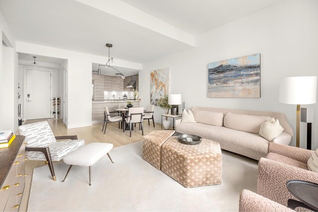 155 W 11th St Unit 14D, New York City, NY 10011 - living area with light wood finished floors and baseboards
