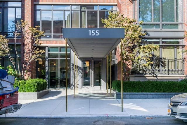 155 W 11th St Unit 14D, New York City, NY 10011 - view of exterior entry with brick siding