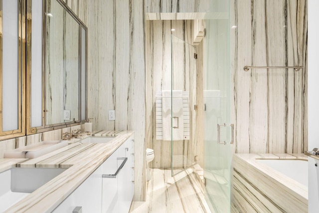 155 W 11th St Unit 14D, New York City, NY 10011 - bathroom with a bath, a marble finish shower, toilet, and double vanity