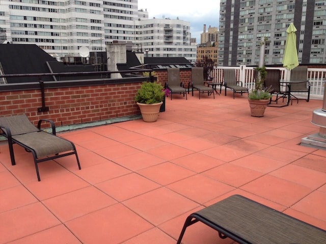 220 E 67th St Unit 11F, New York City, NY 10065 - view of patio / terrace featuring a view of city