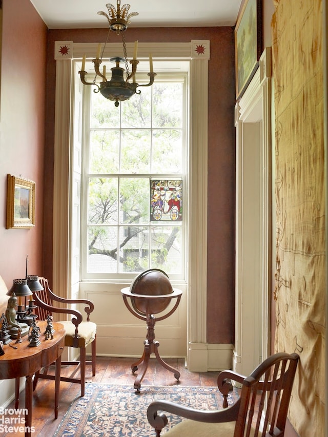 203 Prince St, New York City, NY 10012 - living area featuring a chandelier and baseboards