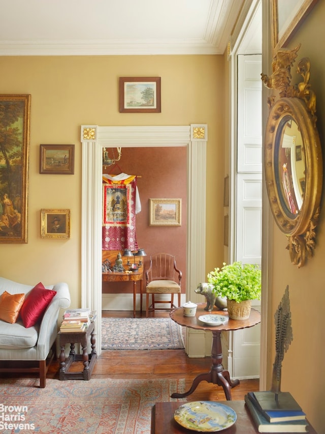 203 Prince St, New York City, NY 10012 - hallway featuring wood finished floors and ornamental molding