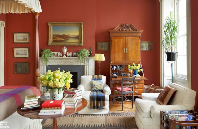 203 Prince St, New York City, NY 10012 - living area featuring a fireplace and wood finished floors