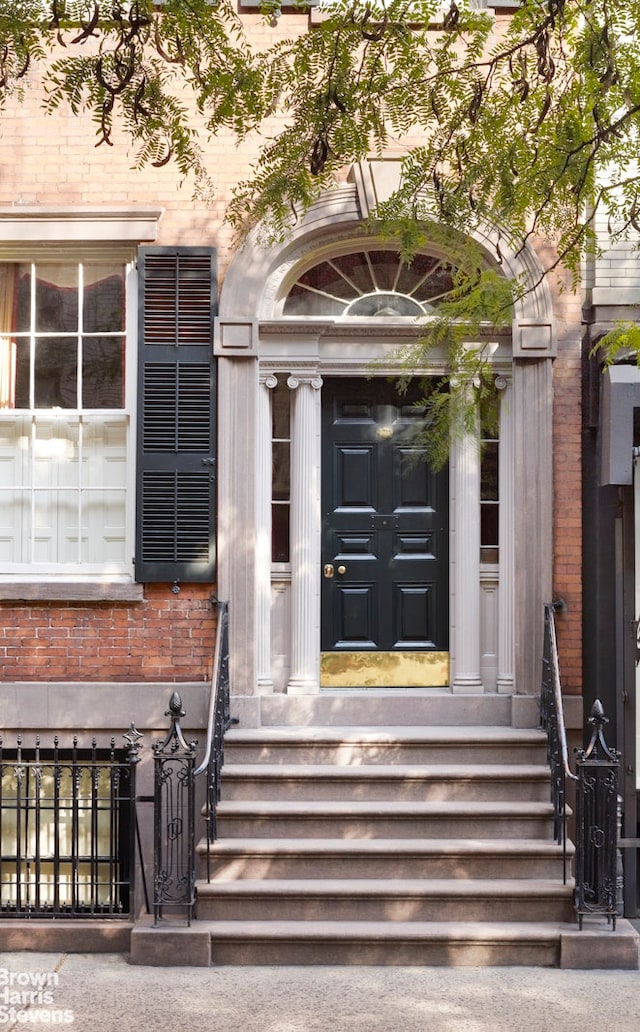 203 Prince St, New York City, NY 10012 - doorway to property featuring brick siding
