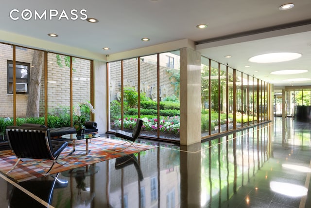 1025 5th Ave Unit 8Gs, New York City, NY 10028 - community lobby featuring expansive windows and recessed lighting
