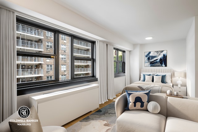 235 E 87th St Unit 7E, New York City, NY 10128 - bedroom featuring wood finished floors