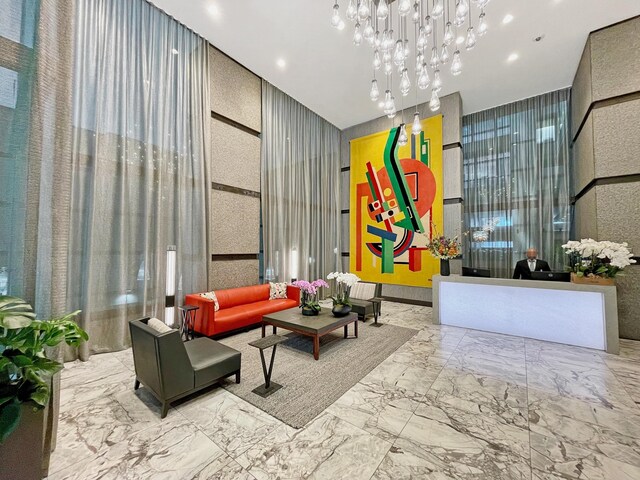 117 E 57th St Unit 35/36F, New York City, NY 10022 - community lobby featuring recessed lighting and a towering ceiling