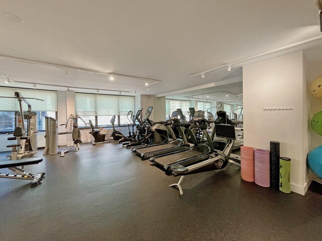 117 E 57th St Unit 35/36F, New York City, NY 10022 - exercise room featuring rail lighting