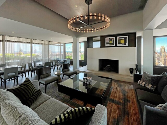 117 E 57th St Unit 35/36F, New York City, NY 10022 - living area with a chandelier and a fireplace with raised hearth
