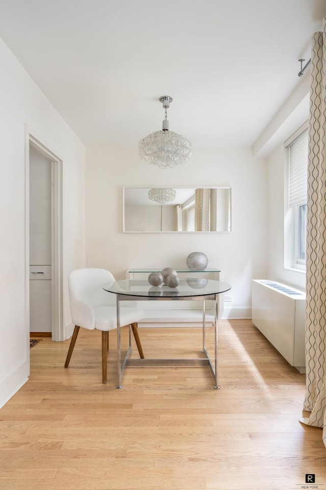 433 E 56th St Unit 6-B, New York City, NY 10022 - dining space featuring breakfast area, light wood-style flooring, and baseboards