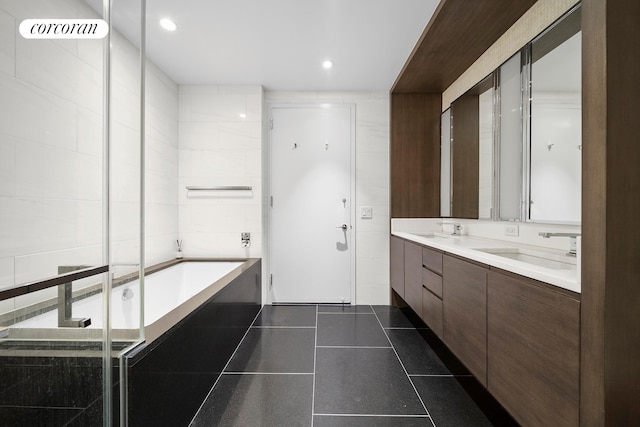 50 Riverside Blvd Unit 4H, New York City, NY 10069 - bathroom with a tub, double vanity, tile patterned flooring, and recessed lighting