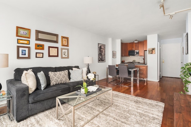 200 W 79th St Unit 9J, New York City, NY 10024 - living area with dark wood-style floors and baseboards