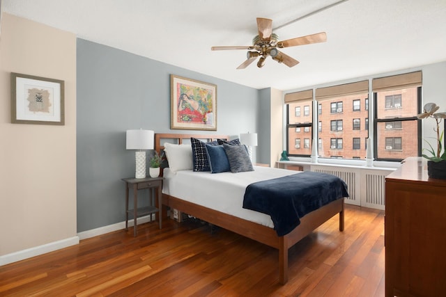 200 W 79th St Unit 9J, New York City, NY 10024 - bedroom featuring radiator heating unit and wood finished floors