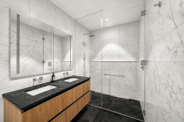 128 W 23rd St Unit 15B, New York City, NY 10011 - bathroom with tile walls, a marble finish shower, and double vanity