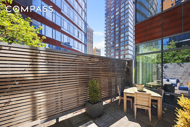 70 Little W St Unit 7L, New York City, NY 10004 - deck featuring a city view and outdoor dining space