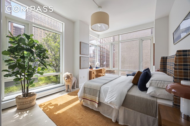70 Little W St Unit 7L, New York City, NY 10004 - bedroom featuring multiple windows