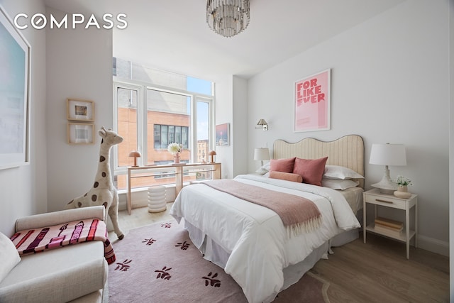 70 Little W St Unit 7L, New York City, NY 10004 - bedroom featuring wood finished floors and baseboards