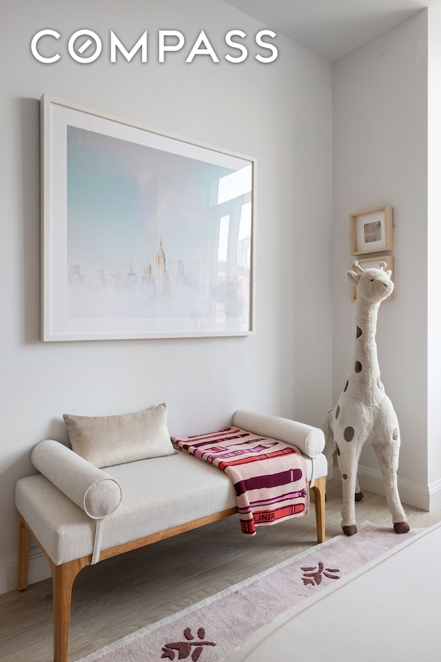 70 Little W St Unit 7L, New York City, NY 10004 - living area with wood finished floors and baseboards