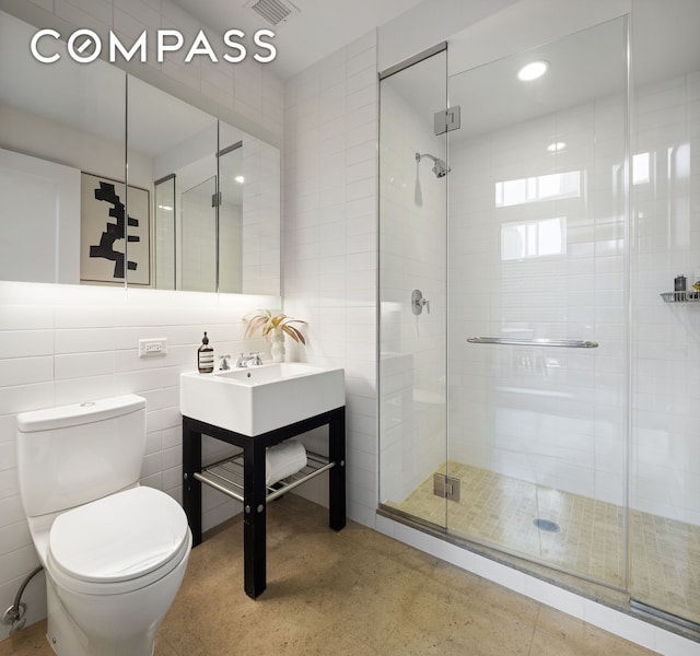 70 Little W St Unit 7L, New York City, NY 10004 - bathroom with toilet, a stall shower, and vanity