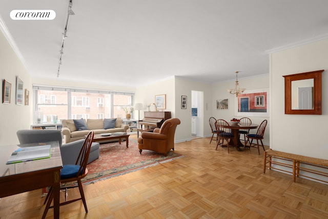 75 E End Ave Unit 6D, New York City, NY 10028 - living room featuring rail lighting, a chandelier, baseboards, and crown molding