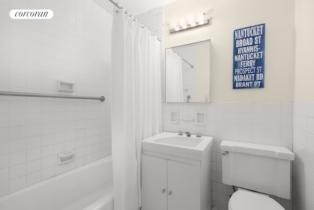 75 E End Ave Unit 6D, New York City, NY 10028 - bathroom with vanity, toilet, shower / bath combo with shower curtain, and tile walls