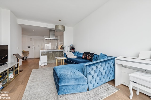 460 W 42nd St Unit 58G, New York City, NY 10036 - living room featuring wood finished floors and recessed lighting
