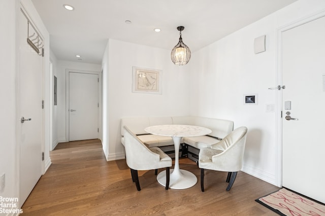 460 W 42nd St Unit 58G, New York City, NY 10036 - dining space featuring wood finished floors, recessed lighting, a chandelier, and baseboards