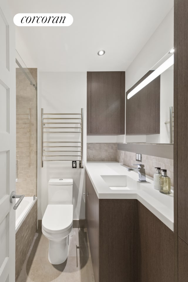 10 Park Ave Unit 3Ab, New York City, NY 10016 - full bath featuring vanity, a towel warmer, toilet, tiled shower / bath combo, and radiator