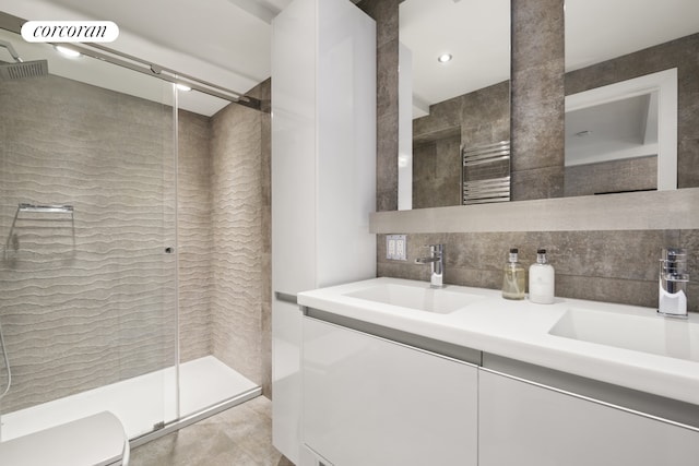 10 Park Ave Unit 3Ab, New York City, NY 10016 - full bath featuring a stall shower, double vanity, toilet, and tile walls