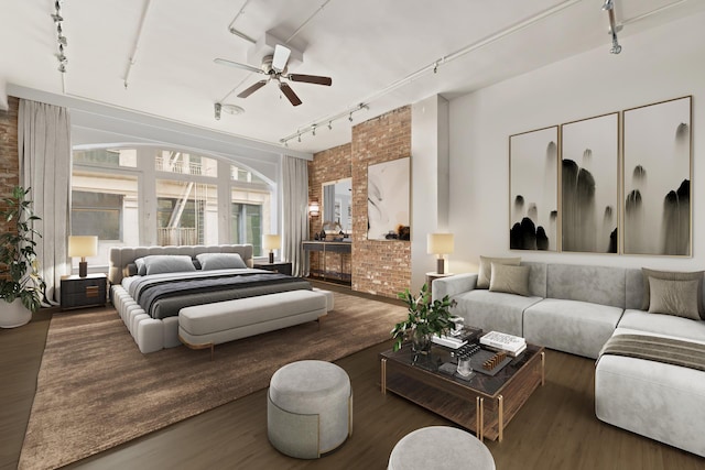 152 Wooster St Unit 2A, New York City, NY 10012 - bedroom with rail lighting, wood finished floors, brick wall, and a ceiling fan