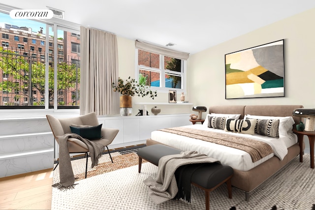 213 E 71st St Unit Ph5, New York City, NY 10021 - bedroom featuring multiple windows and wood finished floors